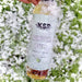 KSR Natural Winter Pom, delicately covered in snow in a 6 fl. oz bottle